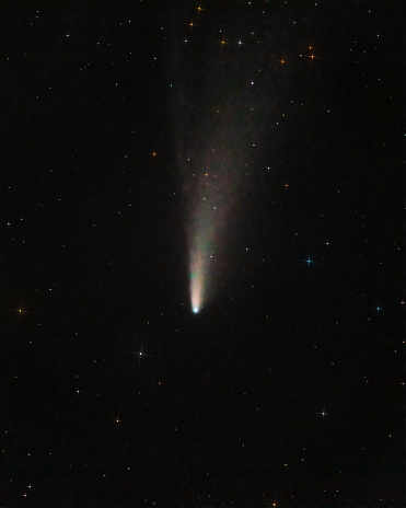 Beautiful photo of comet with large tail in black starry night sky