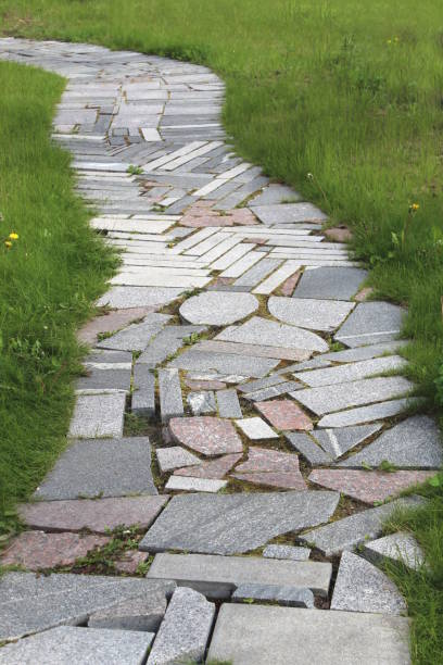 istock The sidewalk path is lined with the remains of marble pieces. 1391754503