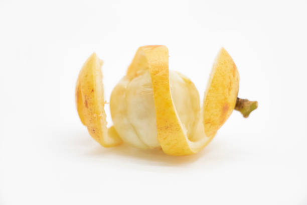 istock Baccaurea motleyana skin slice on white background, selective focus 1391755365