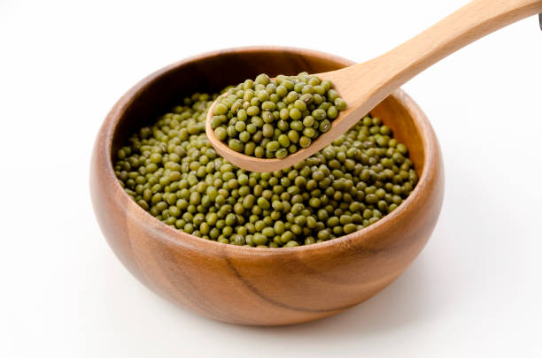 istock mung bean in wooden bowl and spoon on white background 1391757587