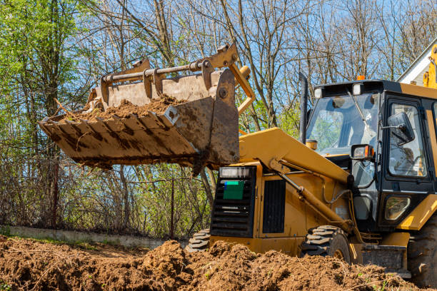 istock Excavator digs soil in village 1391762296