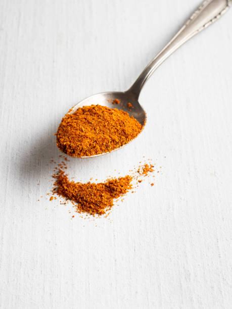 Cajun Food, Cajun Seasoning in a spoon, Cajun spice Asian Food, Close-up, Color Image, Condiment, Spice, Cajun Food, Seasoning, Aromatherapy, Backgrounds, Cayenne, Food and drink,  Salt - Seasoning cayenne powder stock pictures, royalty-free photos & images