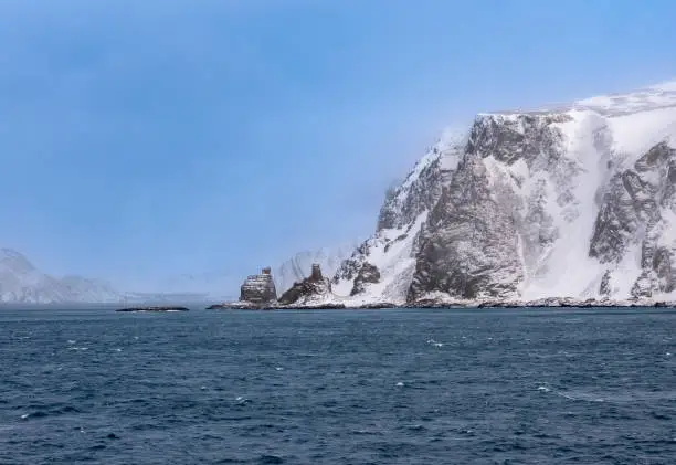 Photo of Finnkirka (Finn Church), a sacred sea cliff for the Sami people, fishermen and navigators passing the northernmost region of the European mainland, Nordkyn, Norway