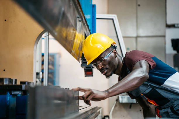 istock Afroamerican bluecollar worker in a factory 1391765238