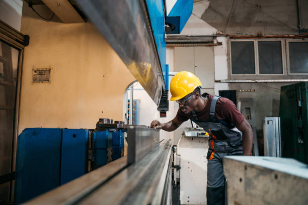 istock Afroamerican bluecollar worker in a factory 1391765240