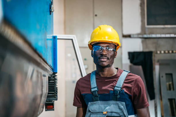 istock Afroamerican bluecollar worker in a factory 1391765241