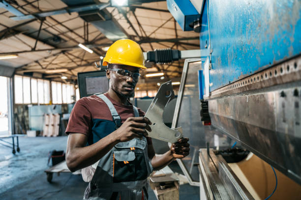 istock Afroamerican bluecollar worker in a factory 1391765265