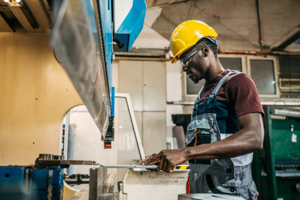 istock Afroamerican bluecollar worker in a factory 1391765308
