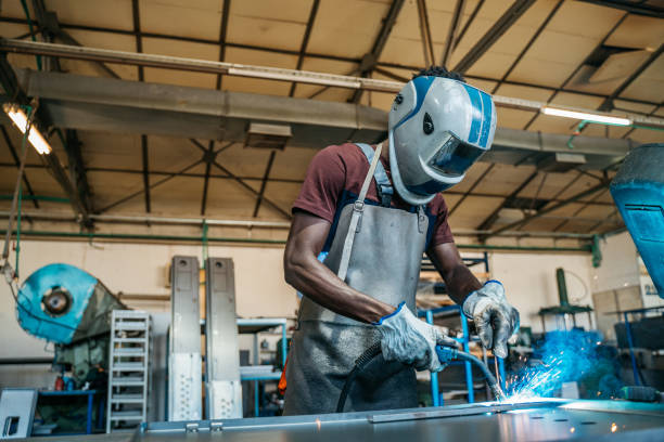 afro american welder - protective glove machinist human hand african descent imagens e fotografias de stock