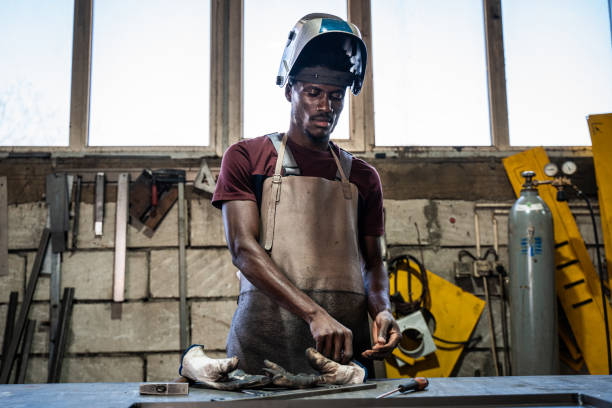 afro american welder - protective glove machinist human hand african descent imagens e fotografias de stock