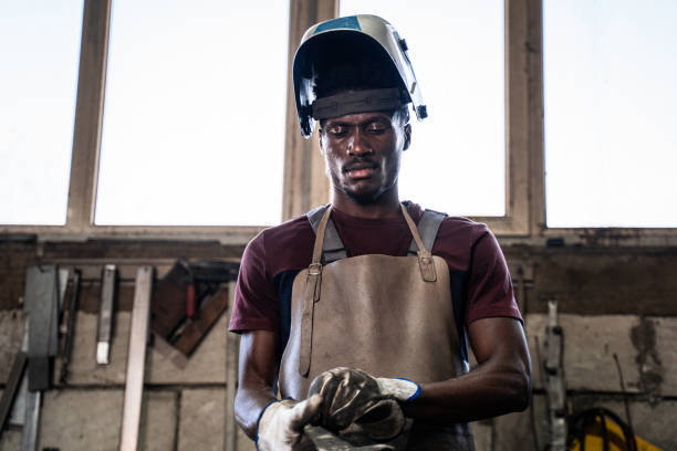 afro american welder - protective glove machinist human hand african descent imagens e fotografias de stock