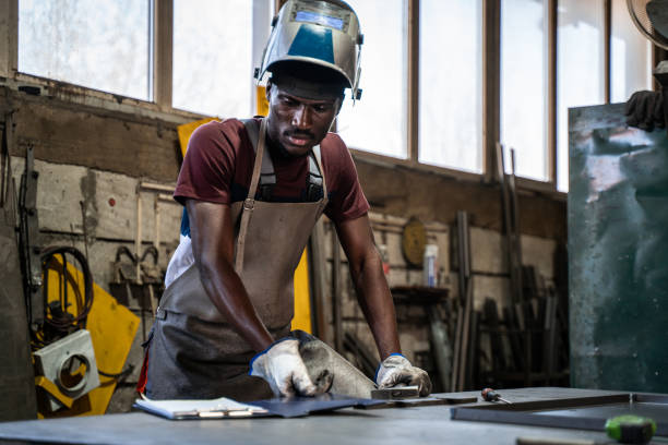 afro american welder - protective glove machinist human hand african descent imagens e fotografias de stock