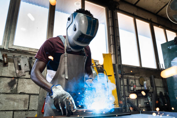 afro american welder - protective glove machinist human hand african descent imagens e fotografias de stock