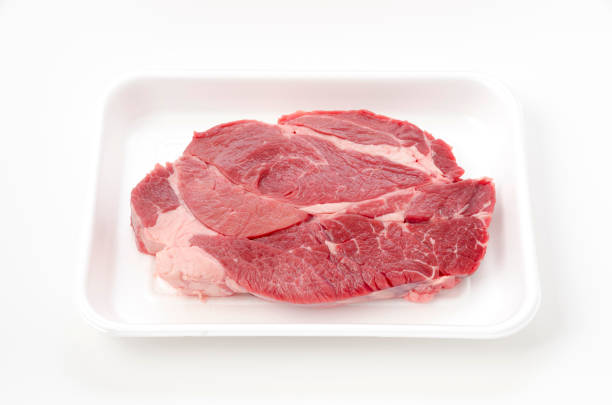 istock Fresh raw beef steak on foam tray on white background 1391767448