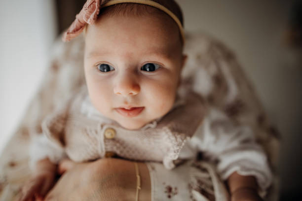 istock Mother holding her baby 1391768325