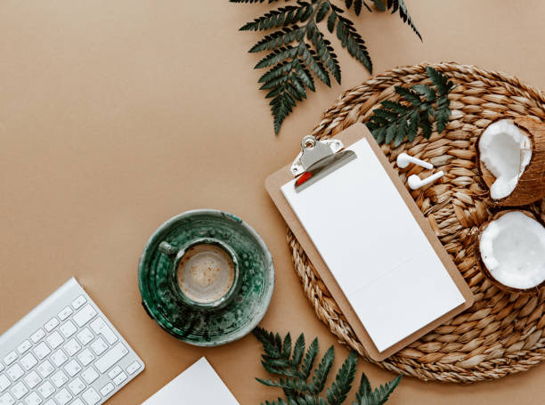 istock Desktop mockup planner. Flat lay with clipboard, coffee cup and green leaves on brown background.Zero waste, eco friendly, natural organic concept. 1391768637