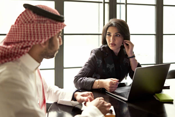 istock Middle Eastern corporate colleagues conversing at meeting 1391771123