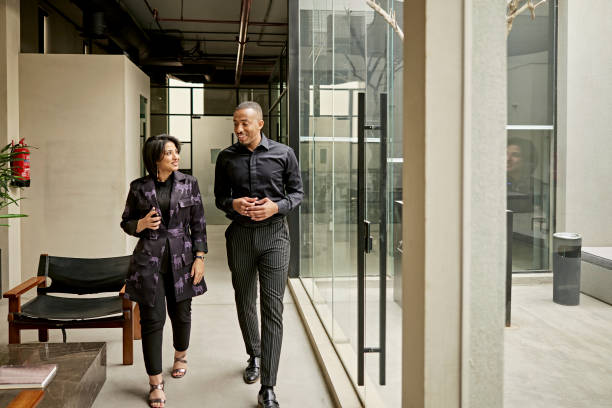 istock Riyadh business colleagues walking and talking 1391771124