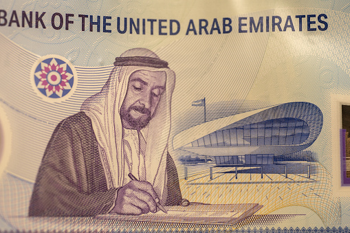 The United Arab Emirates (UAE) - New 2021 Fifty Dirham note macro view very close up of Sheikh Zayed Signing the founding of the nation.