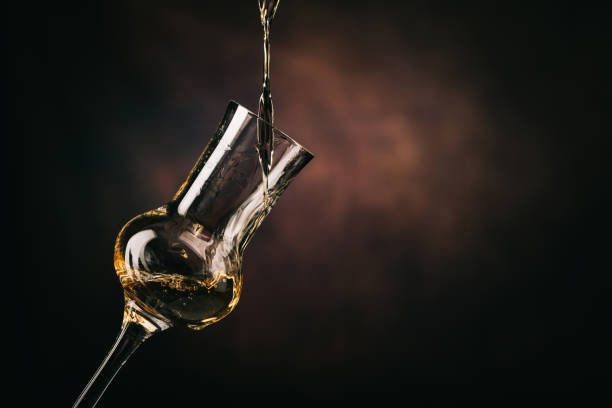 Pouring the Grappa into a glass stock photo