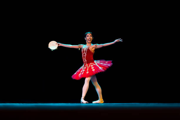 istock Young girl dancing La Esmeralda Ballet on stage 1391773307
