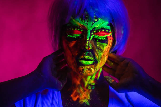 istock Young Woman With Fluorescent Makeup 1391773340