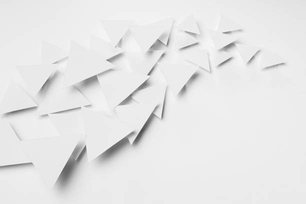 istock Wave of white paper triangles flying in bright light with soft light shadows as energy curved flow, border, copy space, top view. Minimalist softness delicate airy active modern abstract background. 1391774449