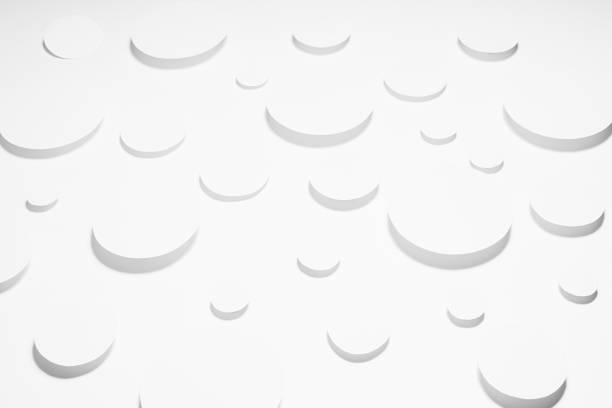 istock Geometric pattern of white ovals in hard light with strict light grey shadows in random, top view. Minimalist modern stable calm abstract background. 1391776485