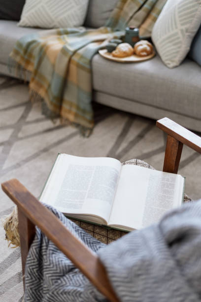 istock Open book lying on retro style armchair 1391779952