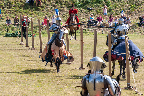 A demonstration of riding and drill of Polish uhlans from 1939, performed by a squadron of a historical reconstruction group. Knight on horseback in armor.