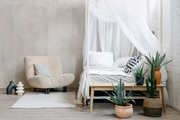 istock Light bedroom interior in bohemian chic apartment 1391780323