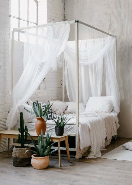 istock White baldachin over bed in boho chic style bedroom 1391780325