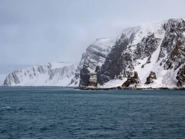 Photo of Finnkirka (Finn Church), a sacred sea cliff for the Sami people, fishermen and navigators passing the northernmost region of the European mainland, Nordkyn, Norway