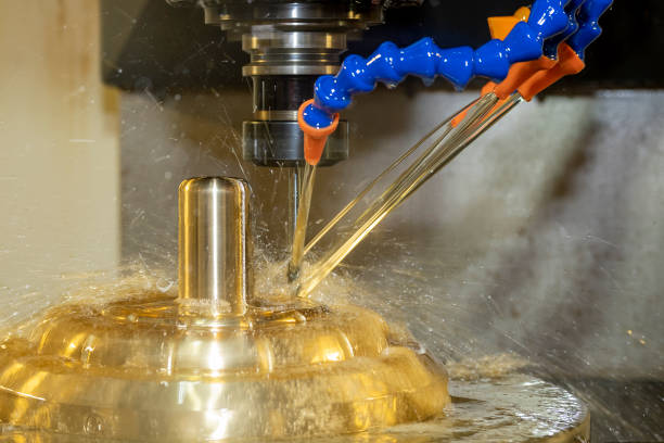 istock The CNC milling machine cutting the shell mold parts with oil coolant method. 1391785388