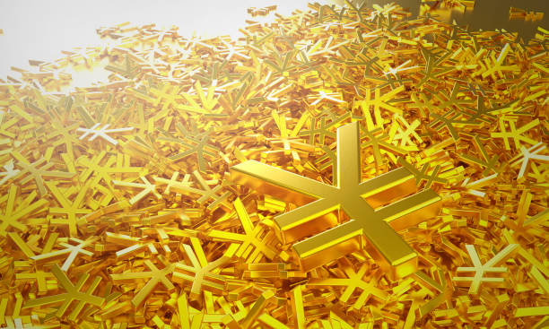 A large pile of reflective gold Japanese yen symbols. stock photo