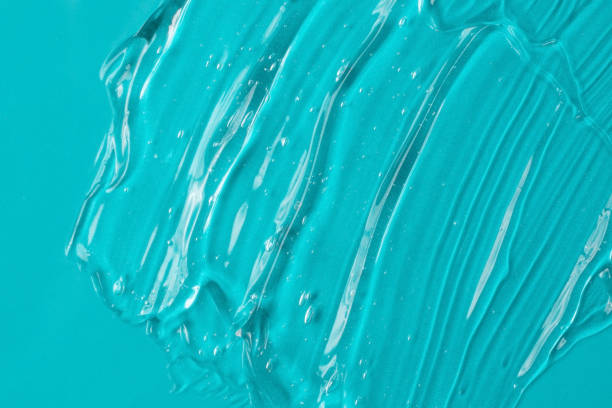 istock Background from turquoise textured cosmetic gel.Top view,antibacterial liquid surface.Good as background or mockup. 1391789229