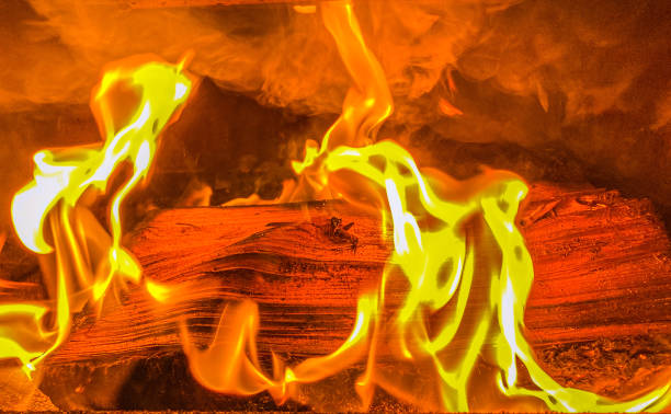 A peaceful fire burns in a wood stove offering warmth and comfort to all.