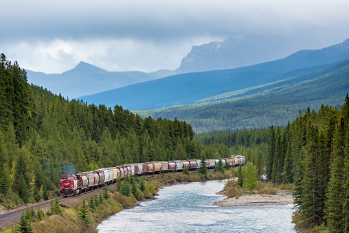 Banff National Park, Alberta, Canada - A large freight Train near Morant’s Curve in Banff National Park, Alberta, Canada.