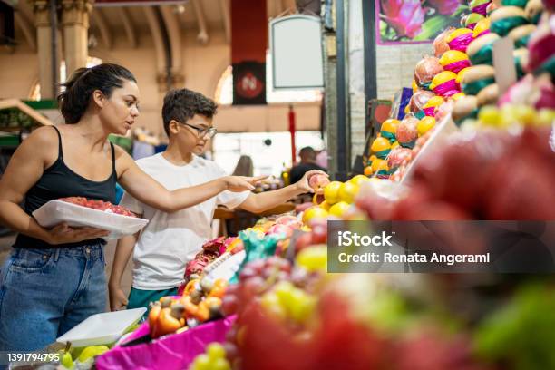 Mother And Son Buying Fruits At The Municipal Market Stock Photo - Download Image Now