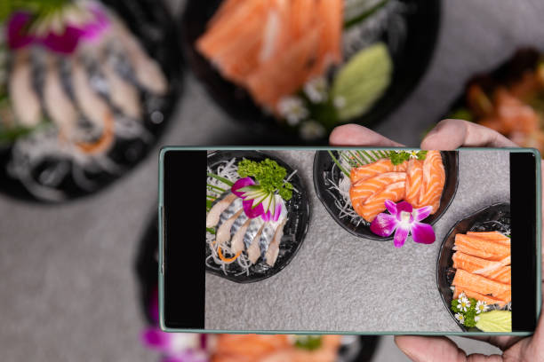 istock Sashimi sushi set with soy on black background.Assorted sushi set served on dark stone slate background. Top view 1391797289