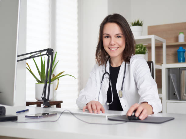 istock Female Doctor working at office desk 1391798276
