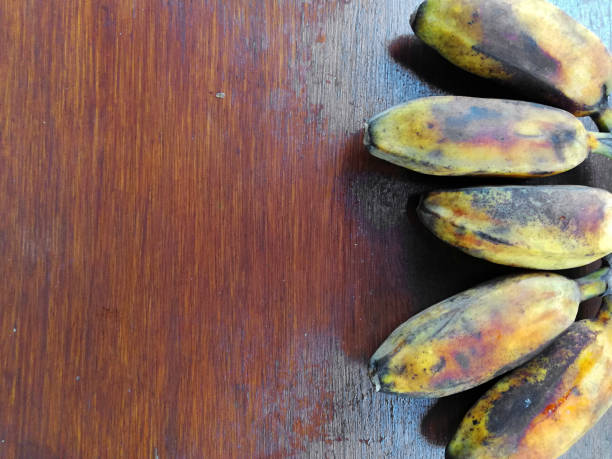 Banana fruits,placed on brown wooden table