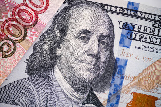 istock A one hundred dollar bill and a five thousand ruble banknote 1391801601