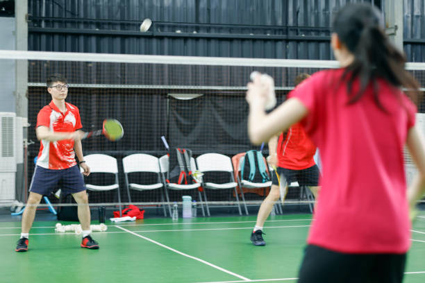 istock Men's and women's mixed doubles pair practice badminton skills 1391802880