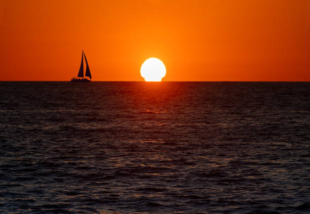 istock Sailboat Silhouette Sailing Ocean Sunset 1391808601