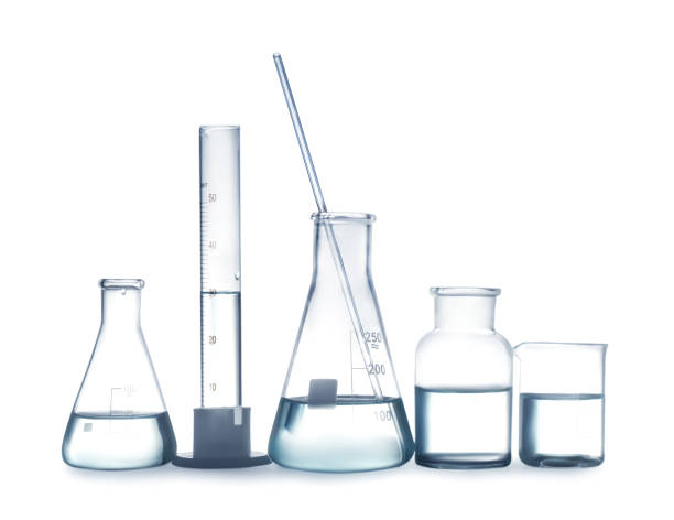 istock Laboratory glassware with liquid isolated on white 1391809750