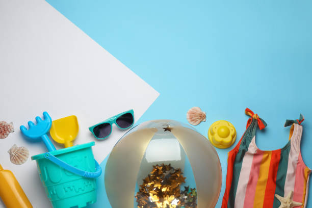 istock Flat lay composition with beach ball and sand toys on color background. Space for text 1391811188