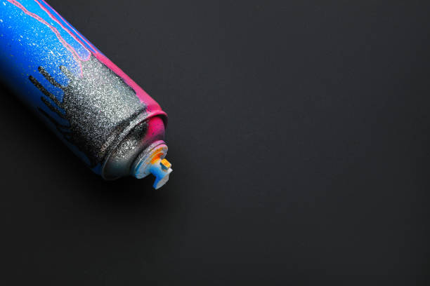 istock Used can of spray paint on black background, space for text. Graffiti supply 1391811403