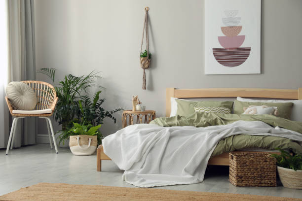 istock Stylish room interior with comfortable wooden bed 1391813496