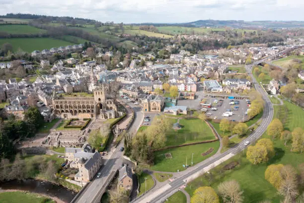 Aerial drone view of the Scottish Borders town of Jedburgh. Located ten miles from the English borders the market town has a long history dating back to the 9th century, with the now ruined site of Jedburgh Abbey that was founded in the 12th century.